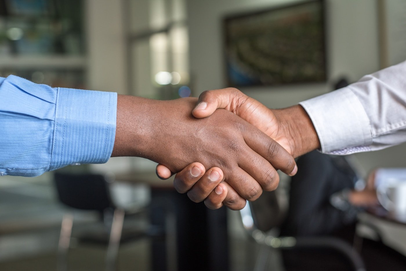 Partnership handshake with international clients